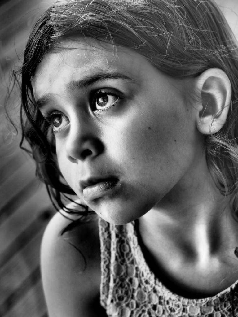 Girl looking out window