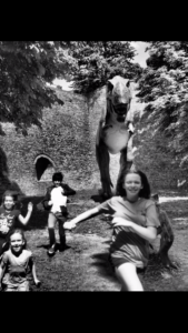 Children run away from TRex in a park