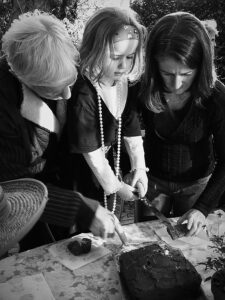 Girl cutting birthday cake